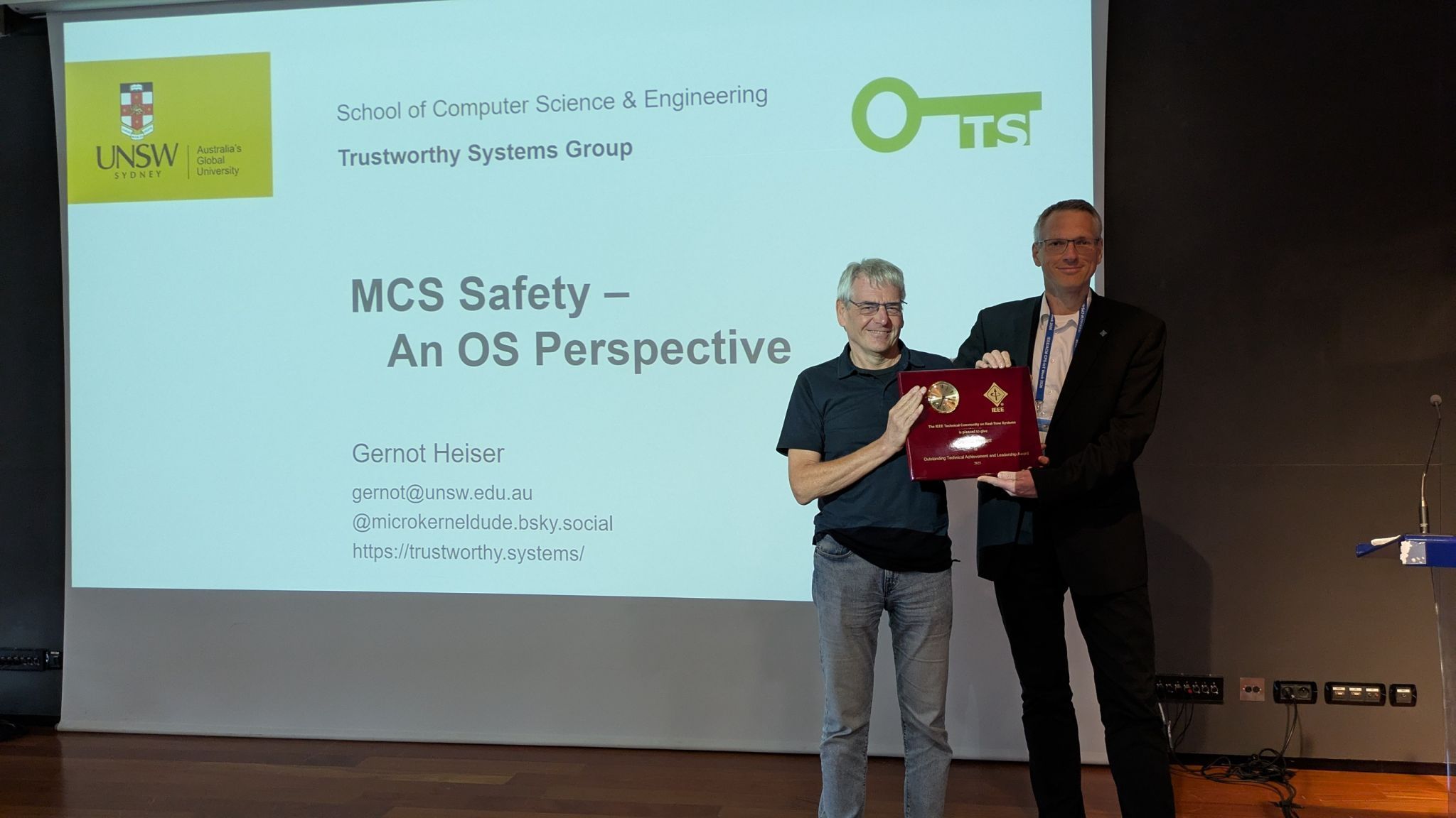 Photo of Gernot Heiser receiving the award at RTAS.